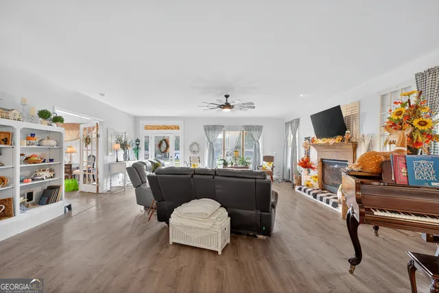 a living room with furniture and a flat screen tv