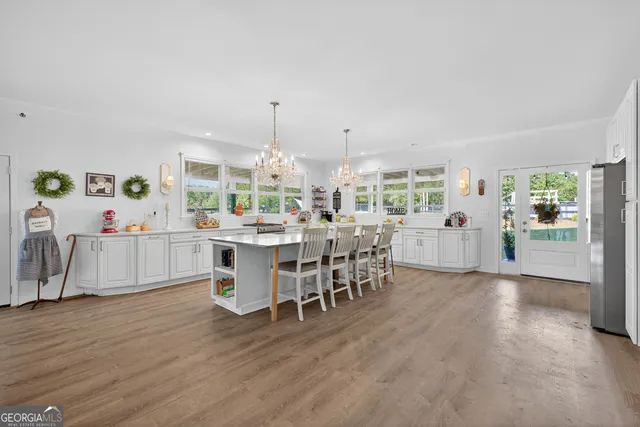 a room with lots of wooden furniture and a wooden floor