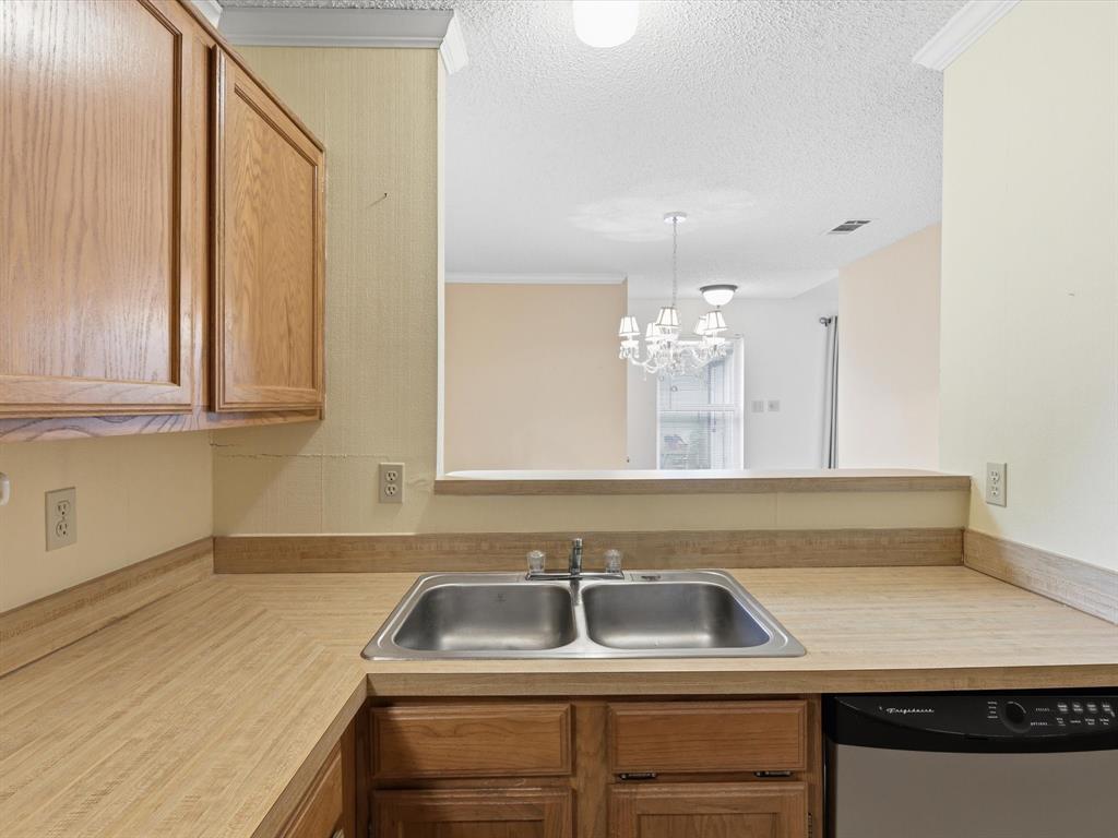 321 Gregory Lane Grand Prairie, TX 75052 - Photo 12 of 27 a bathroom with a sink and a mirror