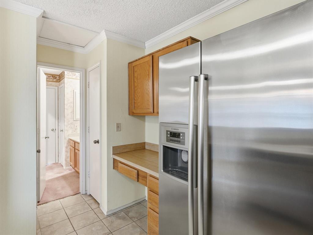 321 Gregory Lane Grand Prairie, TX 75052 - Photo 13 of 27 a bathroom with a glass shower door and a sink
