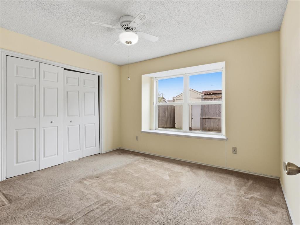 321 Gregory Lane Grand Prairie, TX 75052 - Photo 15 of 27 a view of an empty room with a window