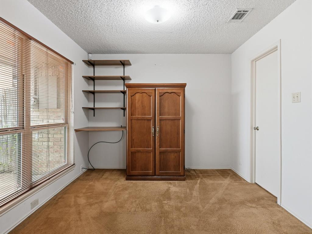 321 Gregory Lane Grand Prairie, TX 75052 - Photo 19 of 27 a view of an empty room with a window