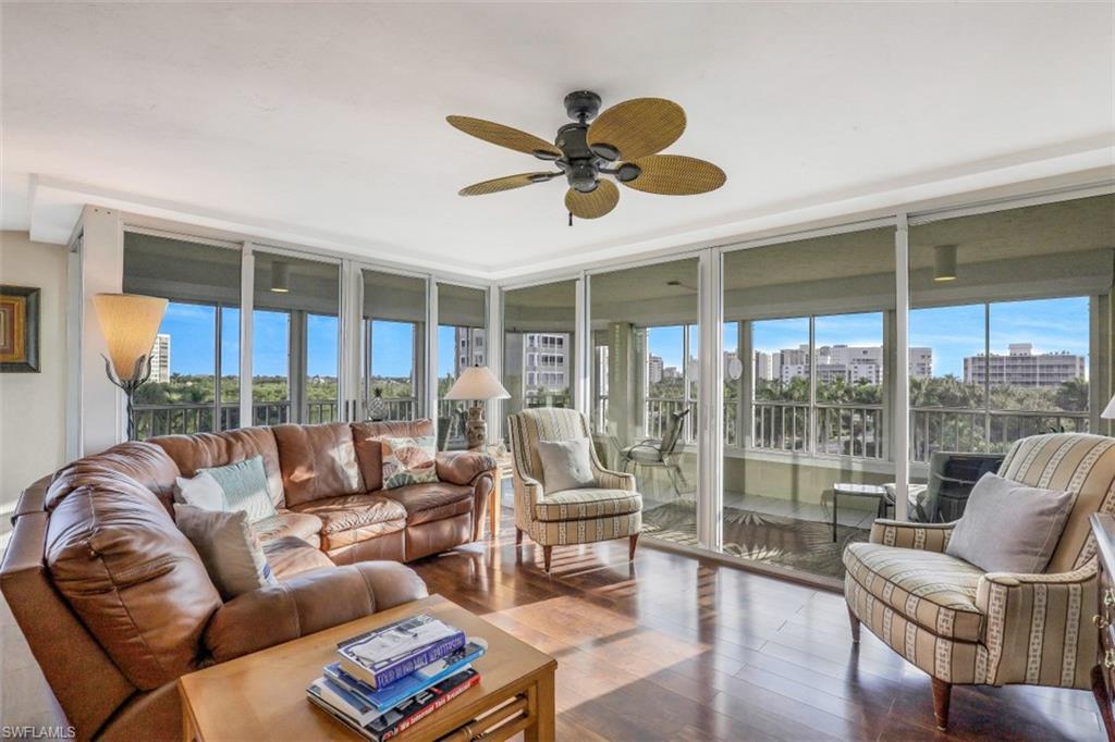 21 Bluebill Avenue, Unit B401 Naples, FL 34108 - Photo 2 of 23 a living room with furniture and a large window
