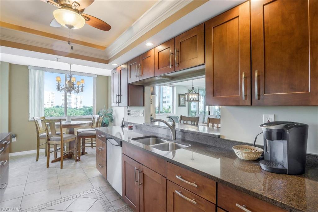 21 Bluebill Avenue, Unit B401 Naples, FL 34108 - Photo 6 of 23 a kitchen with counter space cabinets and appliances