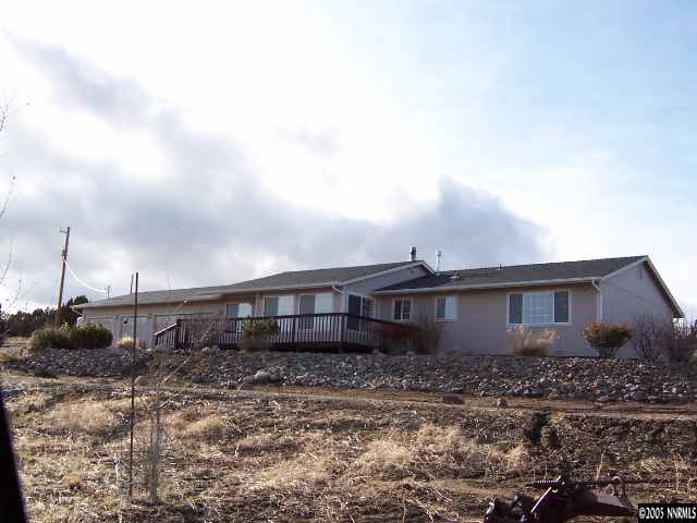 15071 Graham Lane Reno, NV 89508 - Photo 1 of 9 a front view of a house with a garden