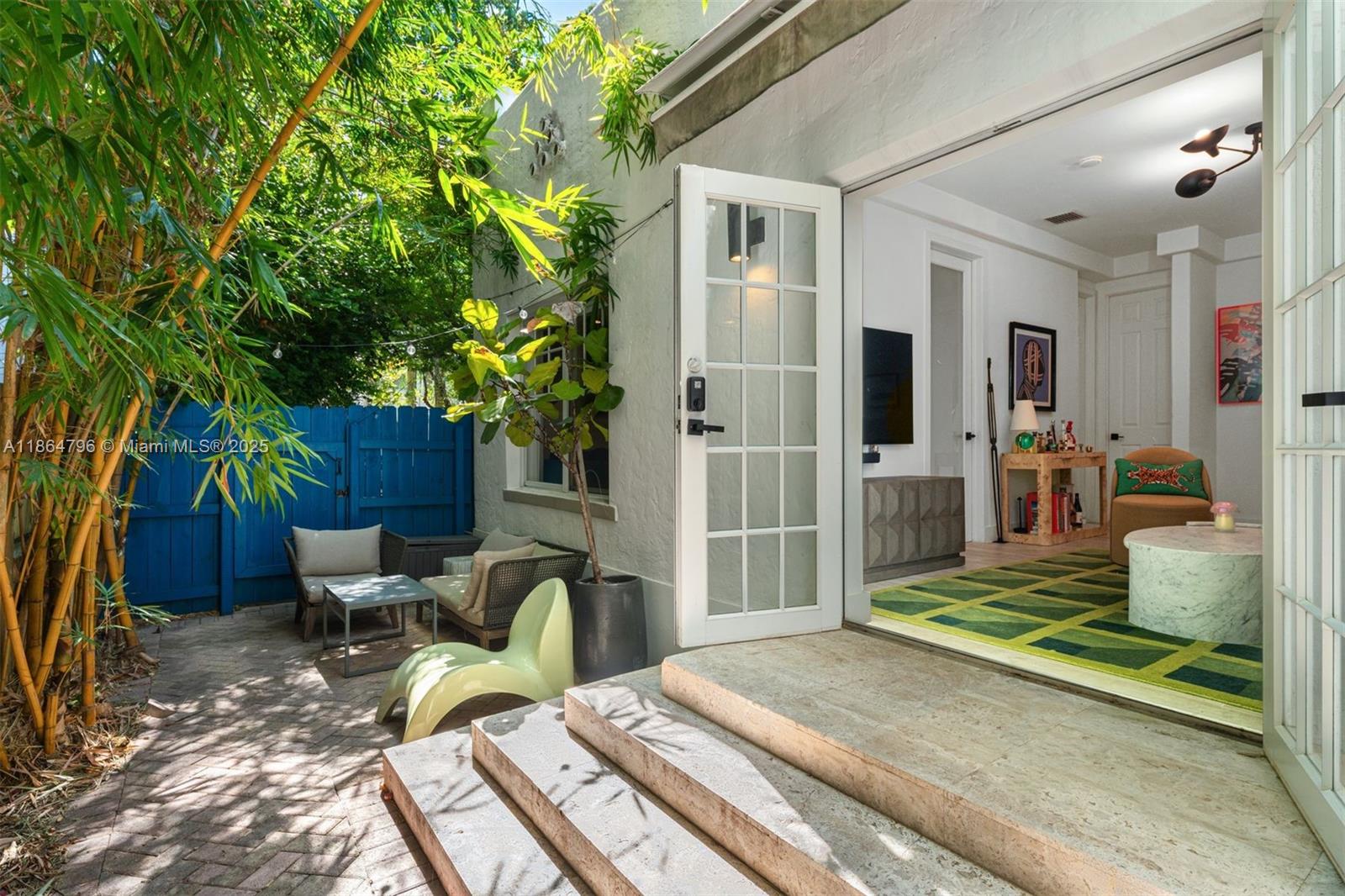 a balcony view with a couch and potted plants