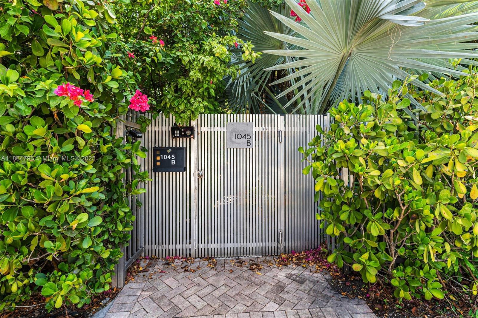 1045 Michigan Avenue, Unit B Miami Beach, FL 33139 - Photo 14 of 15 a sign that is sitting in front of a house