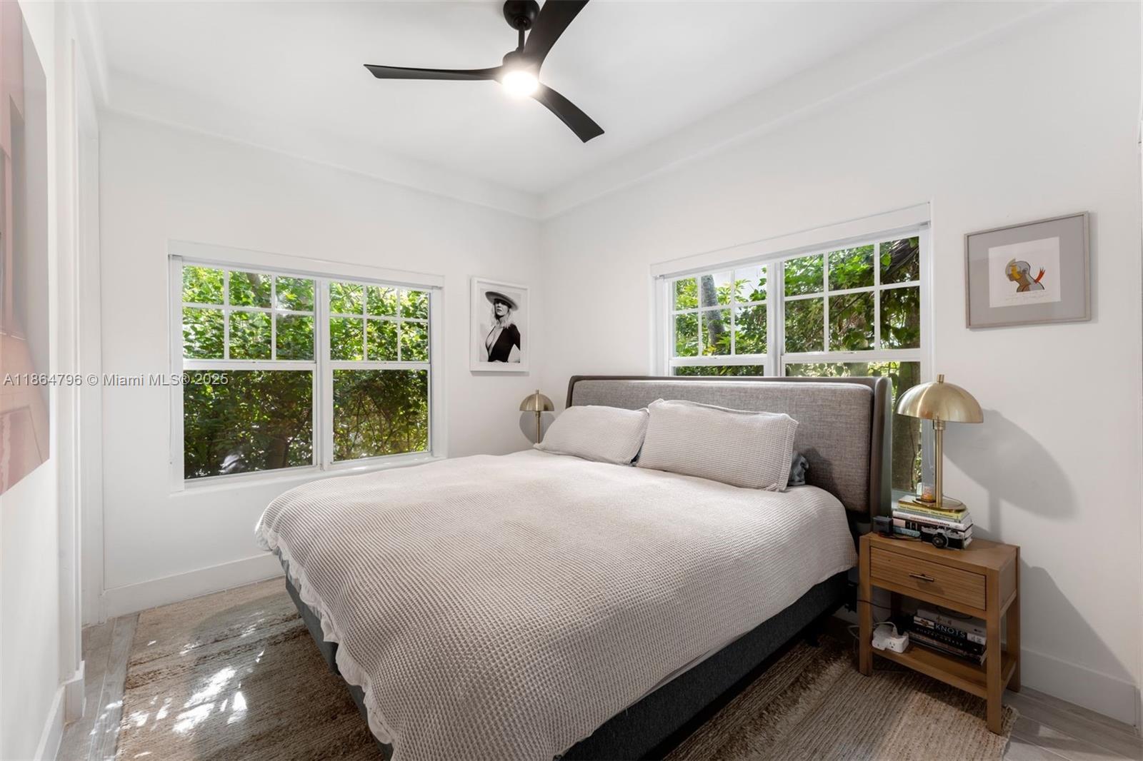 1045 Michigan Avenue, Unit B Miami Beach, FL 33139 - Photo 7 of 15 a bedroom with a bed and a window