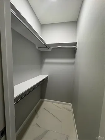 a view of an empty walk in closet
