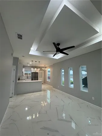a large kitchen with stainless steel appliances a large counter space