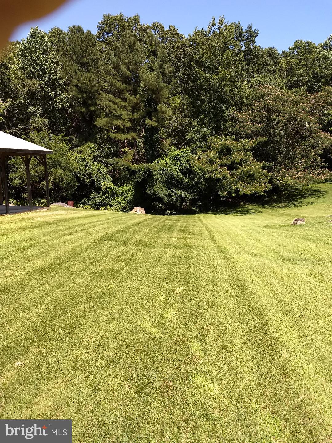 a view of a large yard with an outdoor space