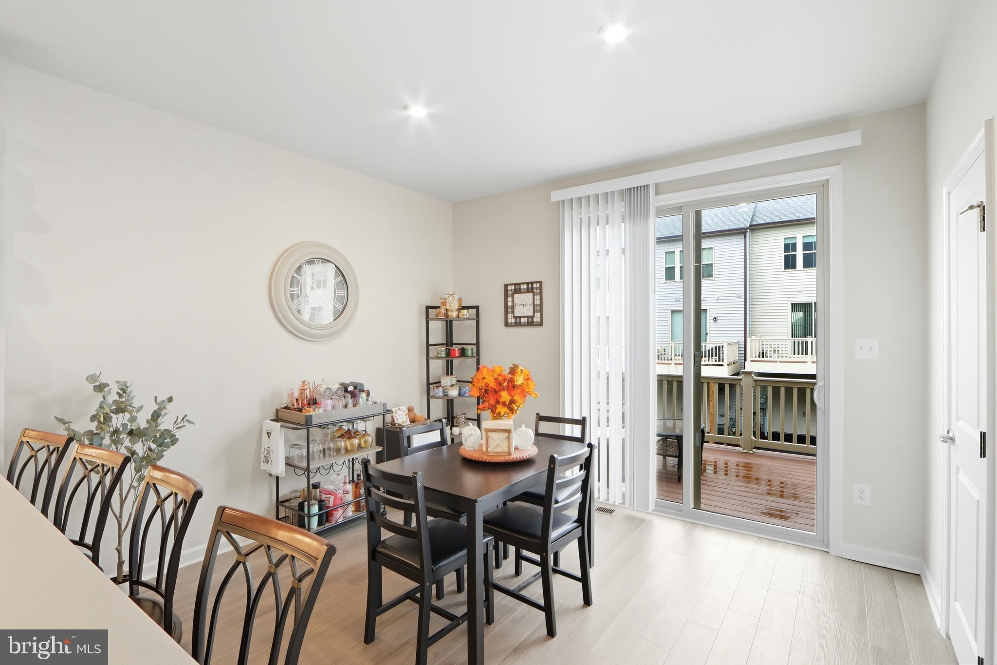 3458 Jacobs Ford Way Hanover, MD 21076 - Photo 12 of 39 a dining room with furniture and wooden floor