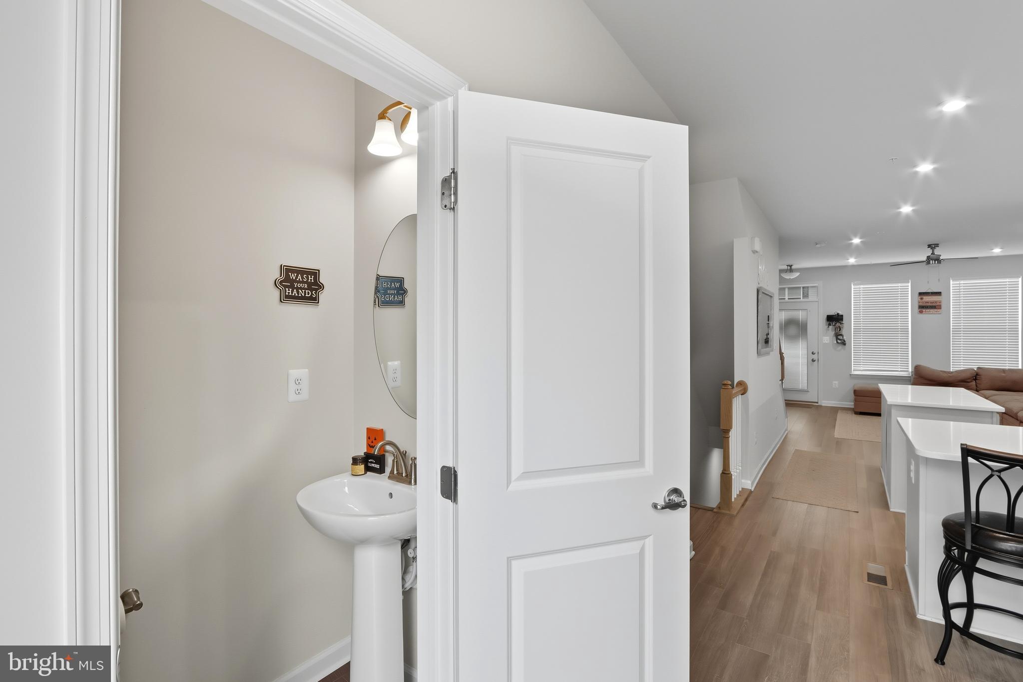 3458 Jacobs Ford Way Hanover, MD 21076 - Photo 15 of 39 a view of a hallway with furniture and a refrigerator