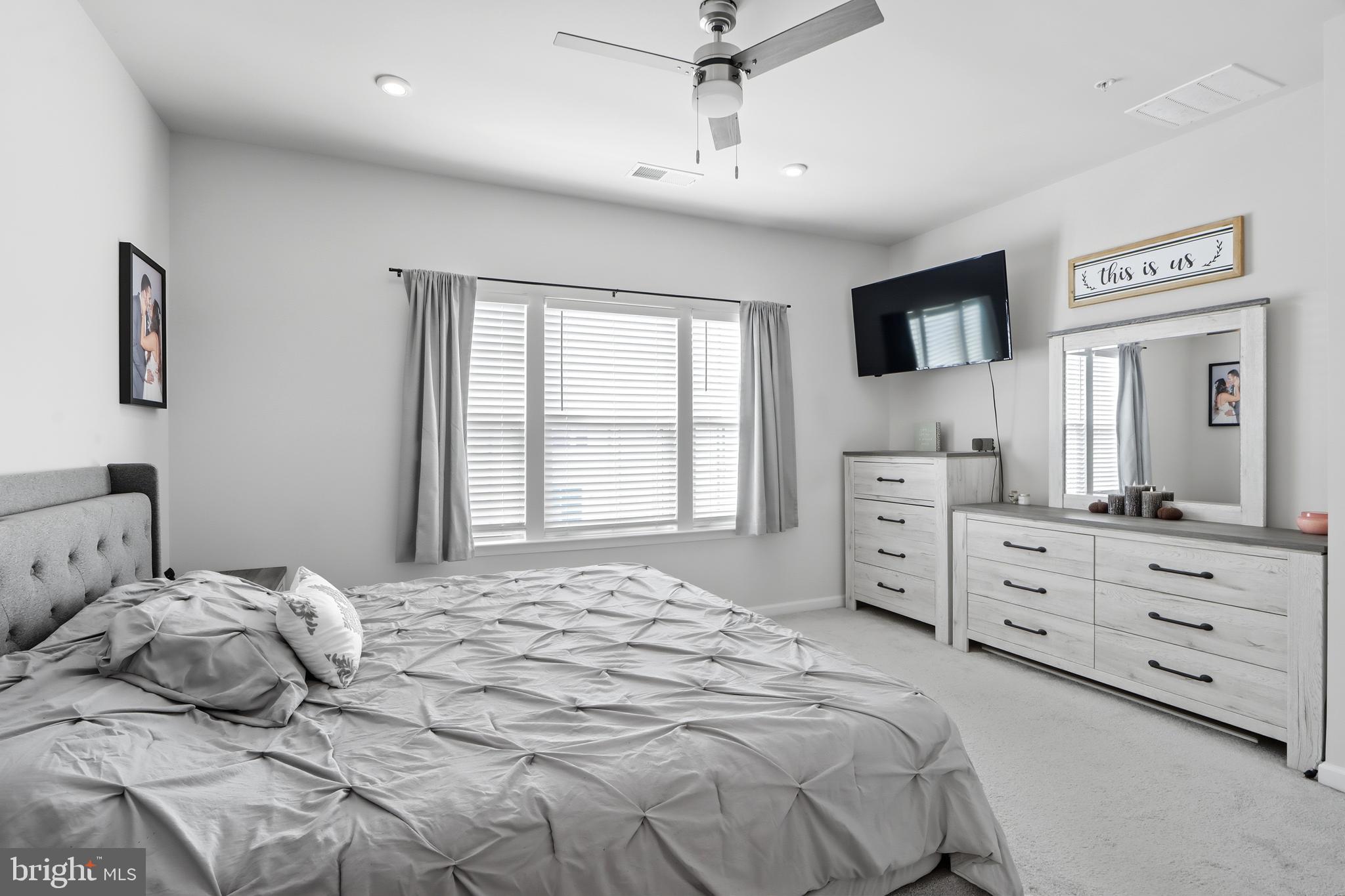 3458 Jacobs Ford Way Hanover, MD 21076 - Photo 18 of 39 a bedroom with a large bed and a dresser