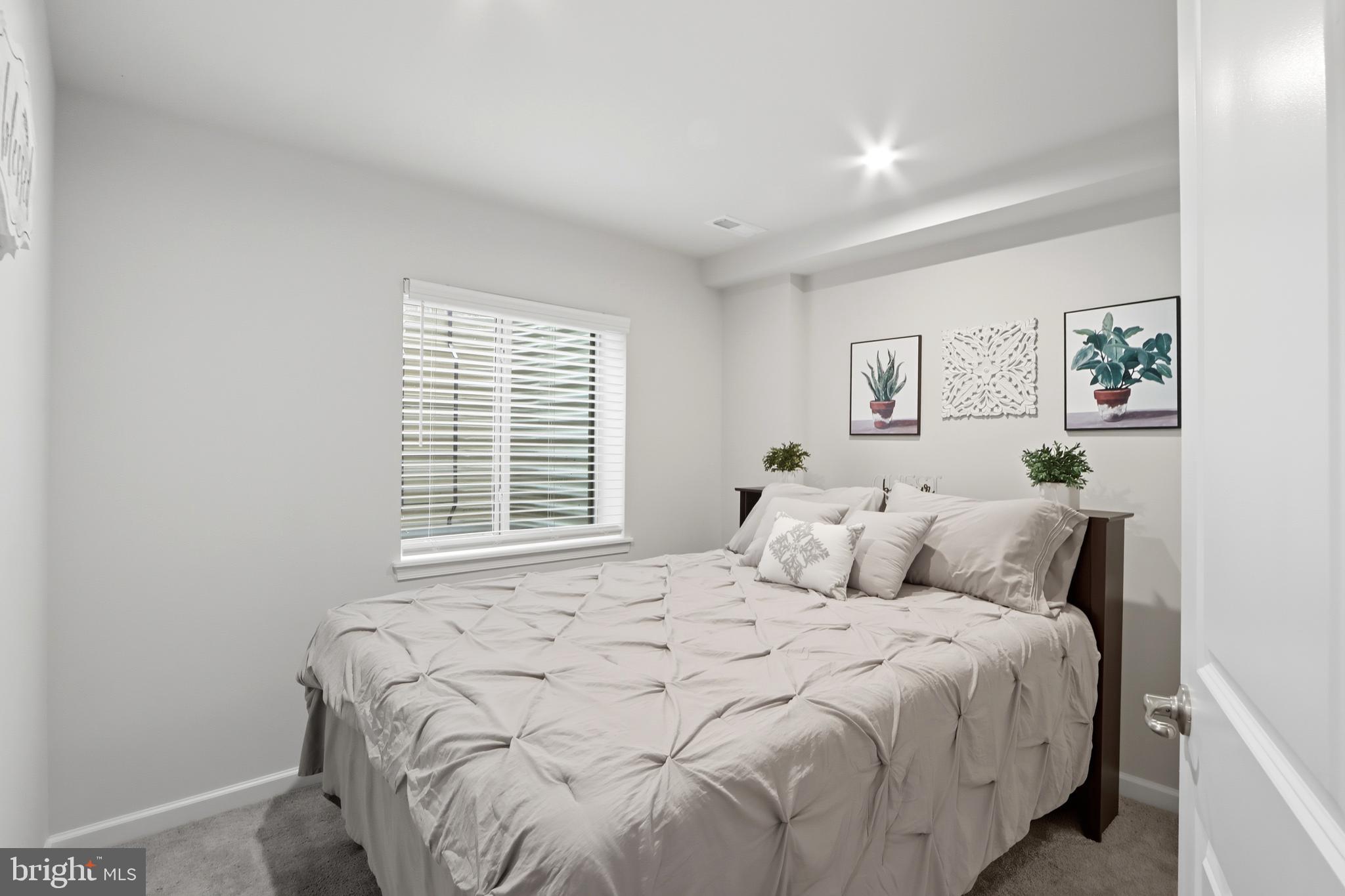 3458 Jacobs Ford Way Hanover, MD 21076 - Photo 30 of 39 a bedroom with a bed and painting on the wall