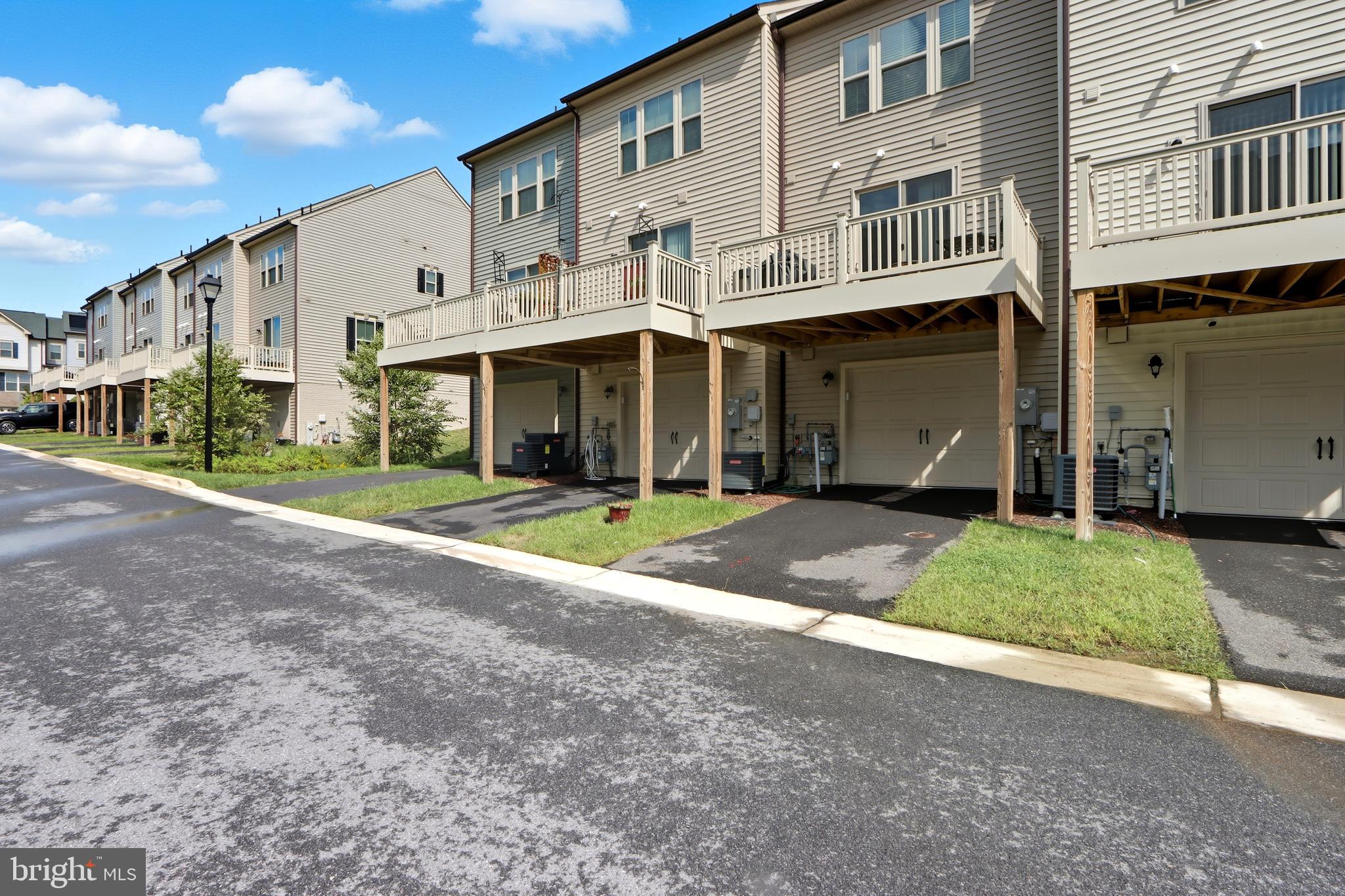 3458 Jacobs Ford Way Hanover, MD 21076 - Photo 31 of 39 a view of a white house with large windows and a yard