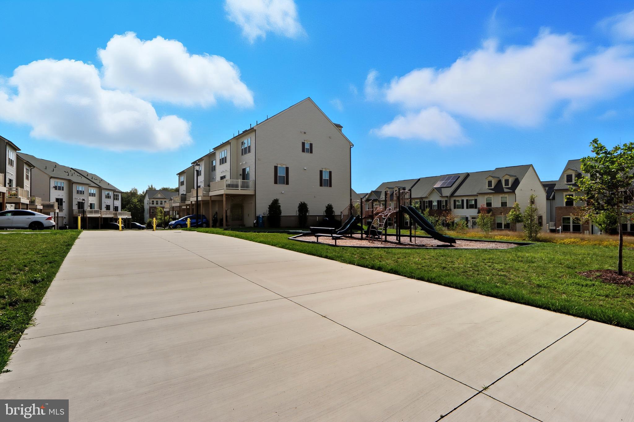 3458 Jacobs Ford Way Hanover, MD 21076 - Photo 35 of 39 a front view of a house with a yard and garage