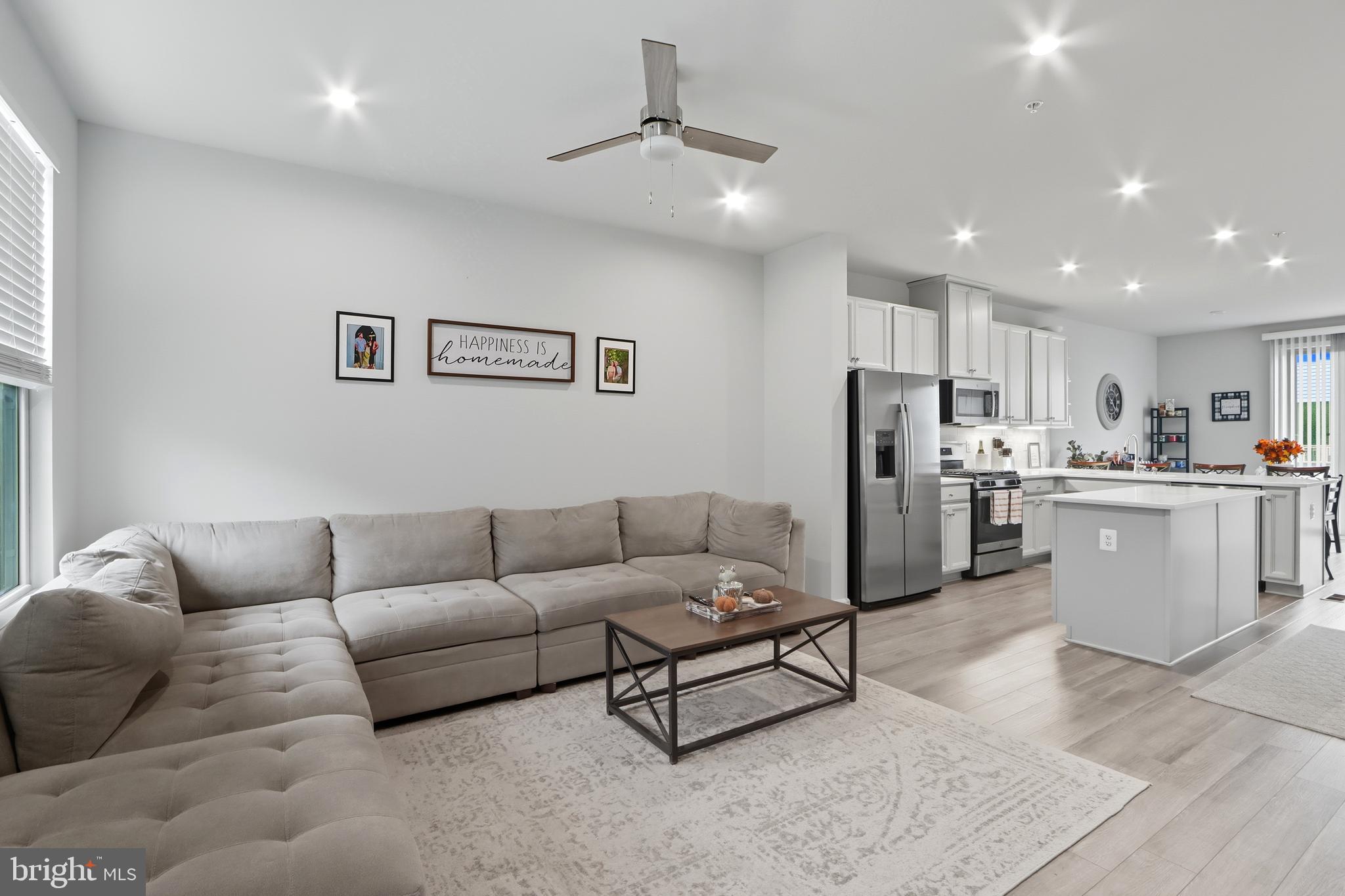 3458 Jacobs Ford Way Hanover, MD 21076 - Photo 4 of 39 a living room with furniture and kitchen view