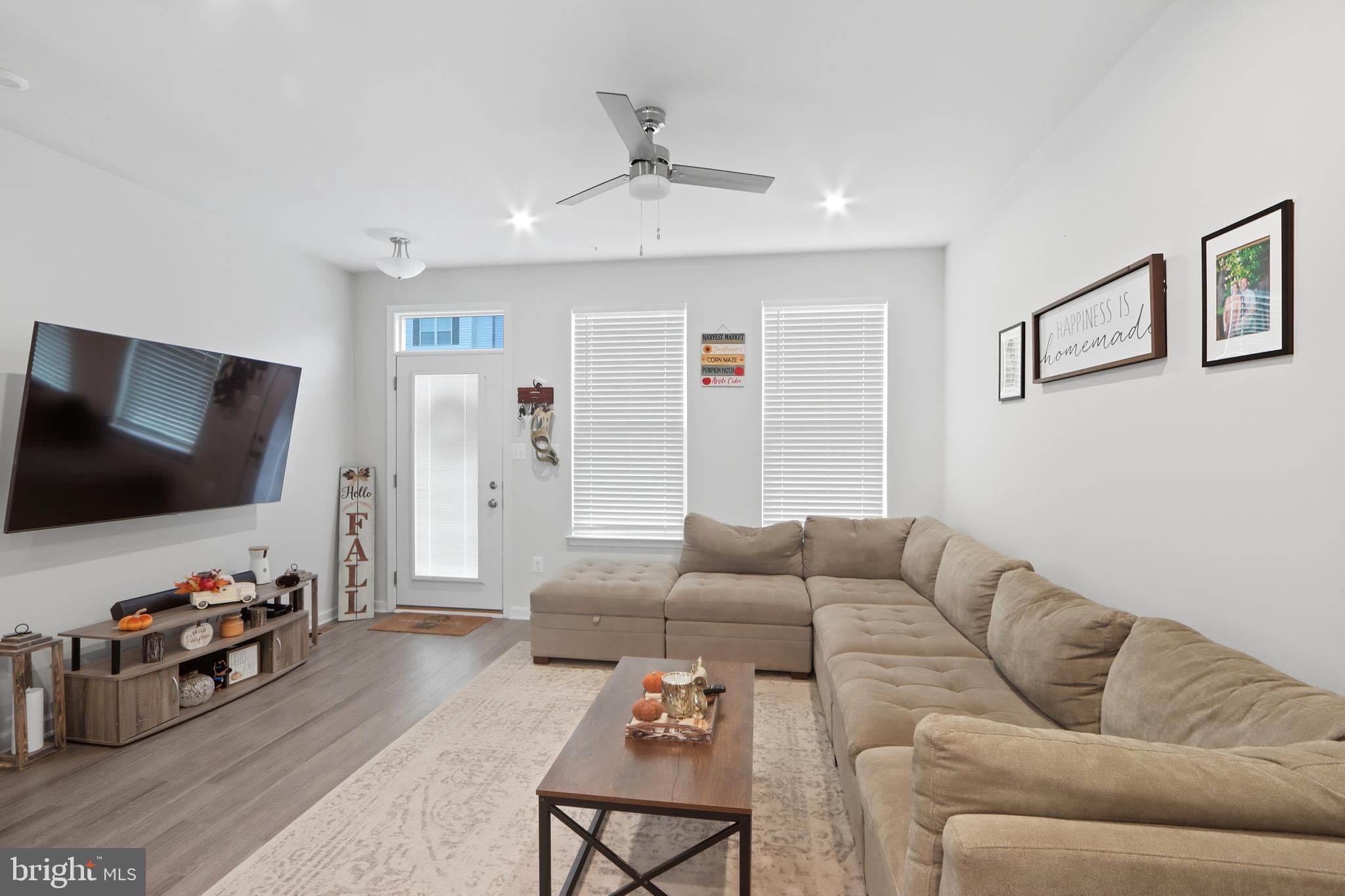 3458 Jacobs Ford Way Hanover, MD 21076 - Photo 7 of 39 a living room with furniture and a flat screen tv