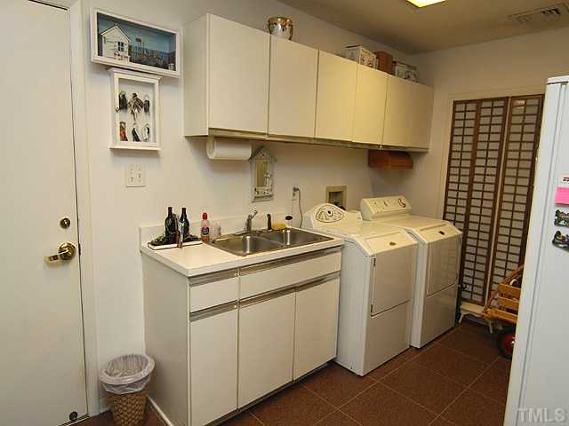 205 Beckley Court Raleigh, NC 27615 - Photo 17 of 25 Spacious Laundry Room with Plenty of Cabinet Space - Large Utility Closet & Room for Freezer/Refrigeraotr
