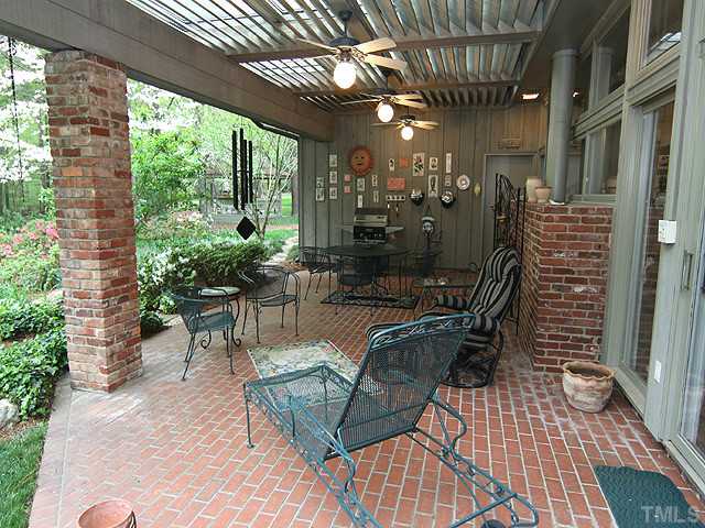 205 Beckley Court Raleigh, NC 27615 - Photo 19 of 25 30x17 Glass Covered Brick Paved Pergola With Four Ceiling Fans Just Waiting For Evening Cookouts