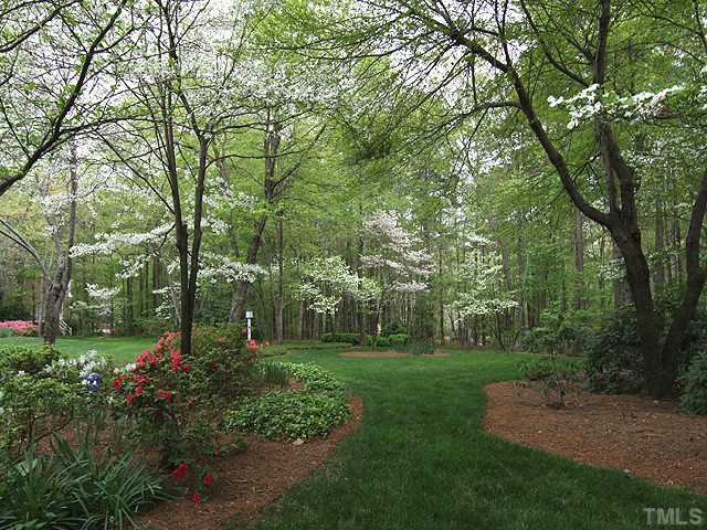 205 Beckley Court Raleigh, NC 27615 - Photo 23 of 25 Breathtaking Beauty - Dogwoods Flank The Well Manicured and Landcaped Lawn