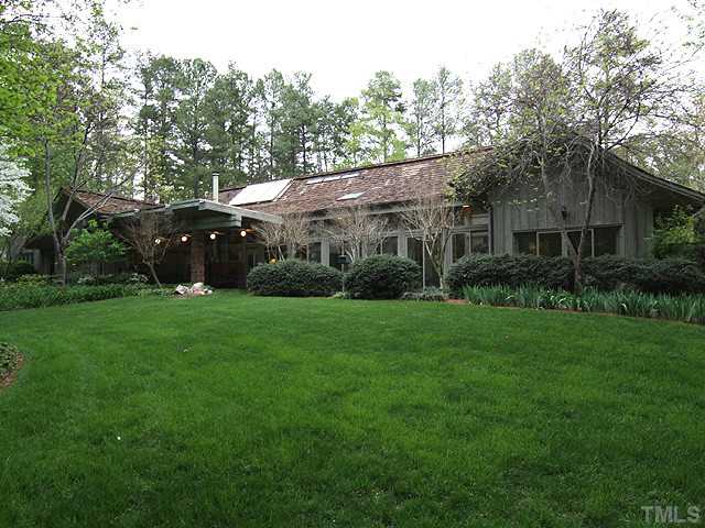205 Beckley Court Raleigh, NC 27615 - Photo 25 of 25 Lush Green Grass With Pictorial View of Rear of Home