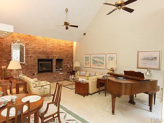 205 Beckley Court Raleigh, NC 27615 - Photo 4 of 25 Open and Flowing Design Offers a Beautiful Reclaimed Brick Wall & Fireplace