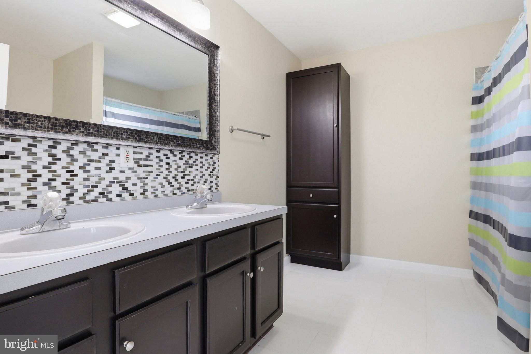 491 Garvine Mill Road Fawn Grove, PA 17321 - Photo 22 of 47 a bathroom with a sink and a mirror