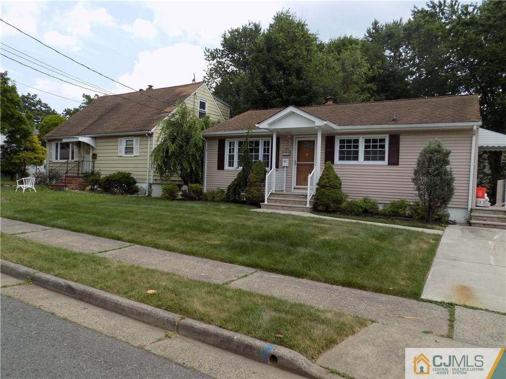 152 Orange Street Edison, NJ 08817 - Photo 2 of 23 a front view of a house with a yard