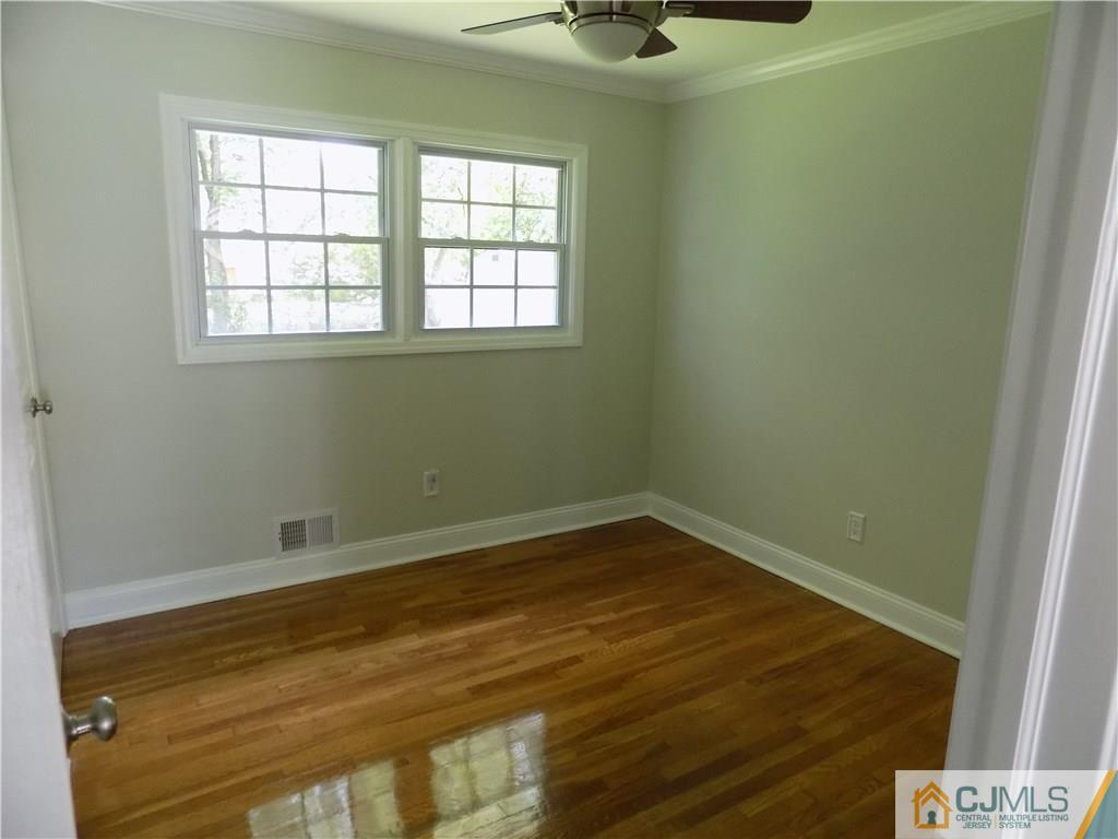 152 Orange Street Edison, NJ 08817 - Photo 12 of 23 a view of an empty room with a window