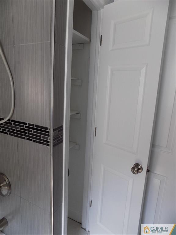 152 Orange Street Edison, NJ 08817 - Photo 16 of 23 a bathroom with a glass door shower