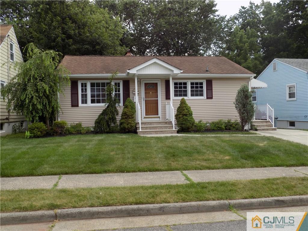 152 Orange Street Edison, NJ 08817 - Photo 3 of 23 a front view of a house with a yard