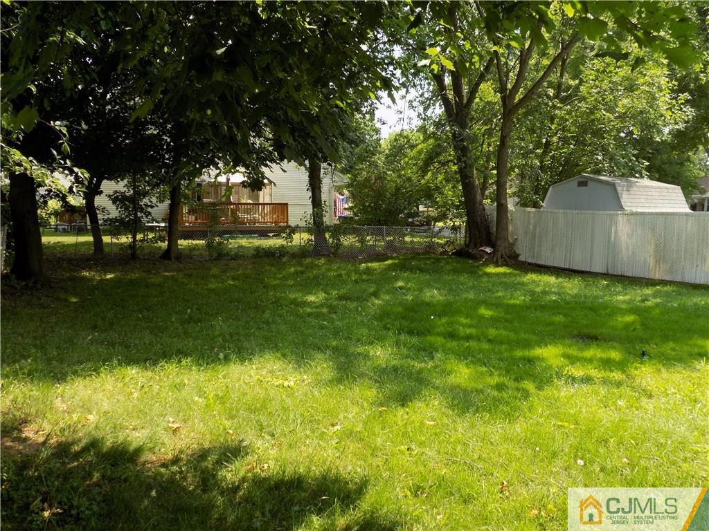 152 Orange Street Edison, NJ 08817 - Photo 22 of 23 a view of a yard with a house in the background
