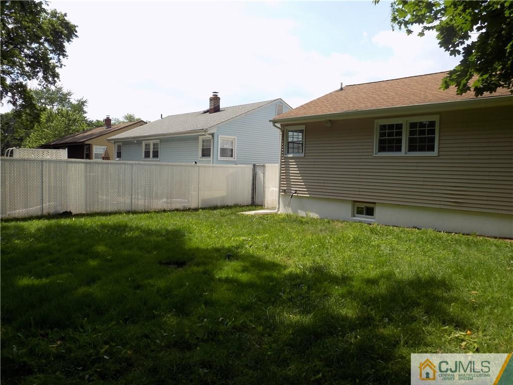 152 Orange Street Edison, NJ 08817 - Photo 23 of 23 a front view of a house with garden