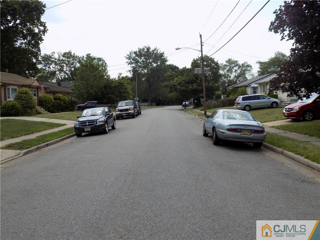 152 Orange Street Edison, NJ 08817 - Photo 4 of 23 a car parked on the side of a road