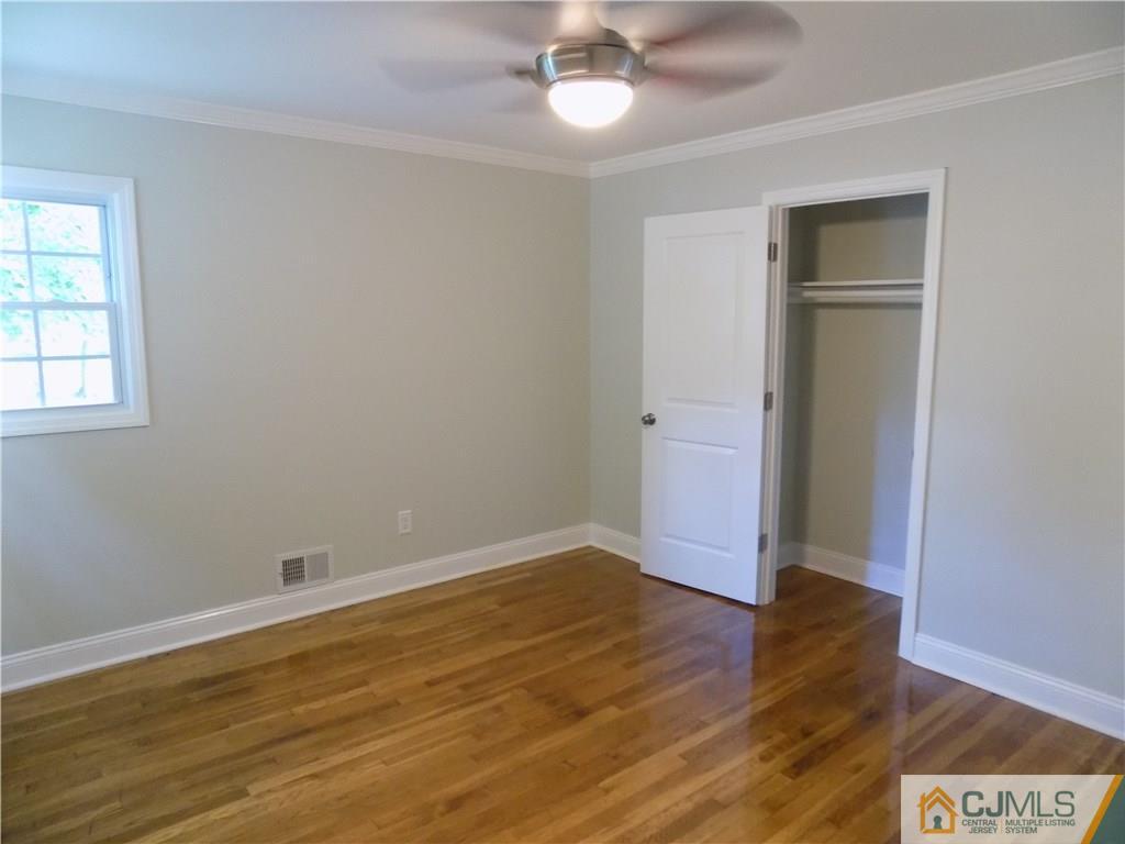 152 Orange Street Edison, NJ 08817 - Photo 10 of 23 wooden floor in an empty room with a window