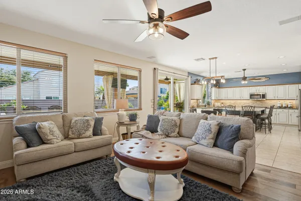 a view of livingroom with furniture wooden floor and windows