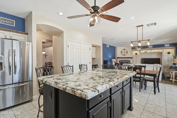 a kitchen with stainless steel appliances granite countertop a sink and cabinets