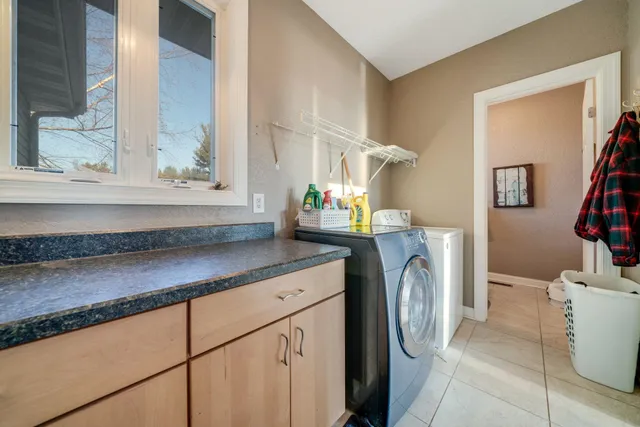 a kitchen with stainless steel appliances a refrigerator and a stove top oven