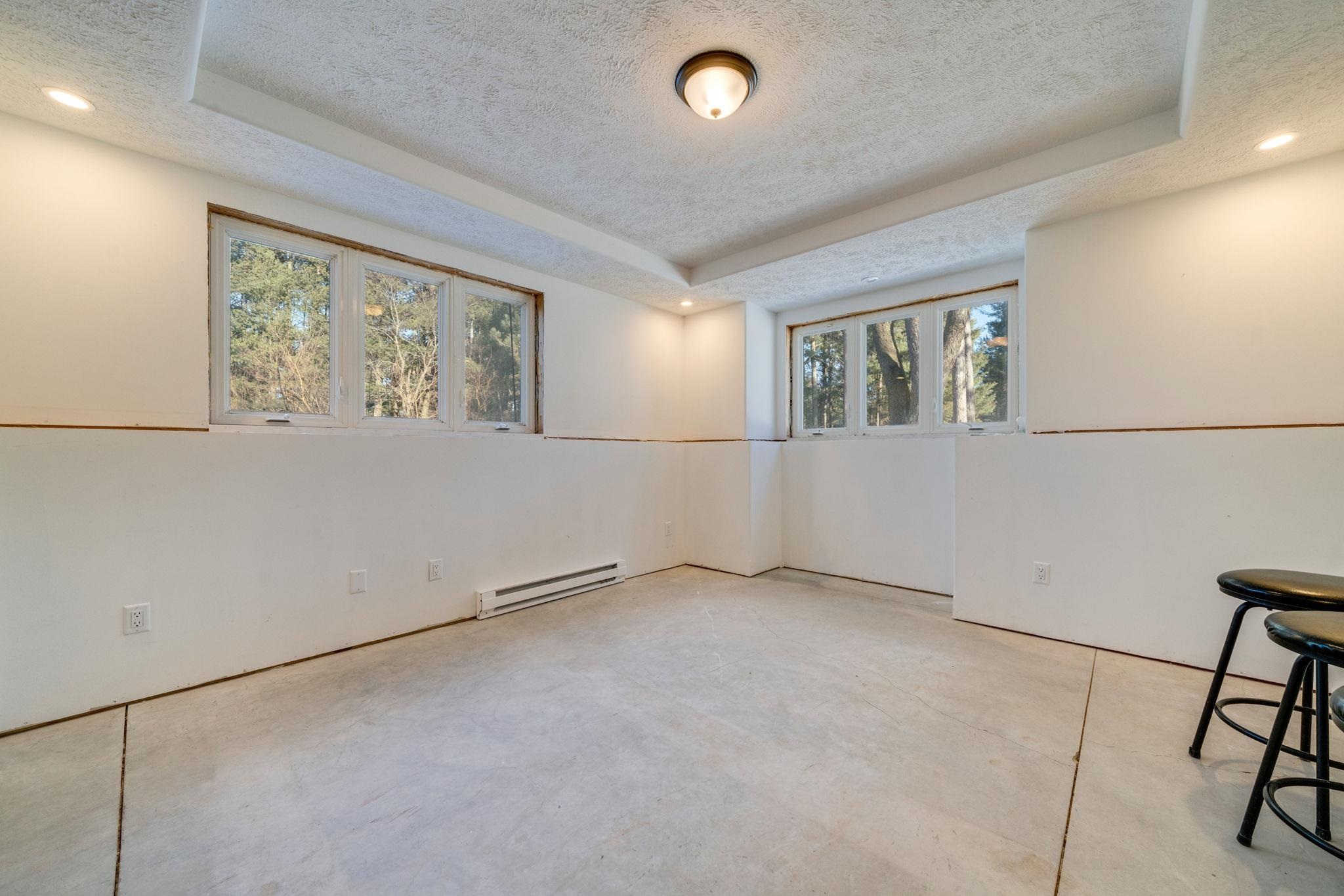 4092 West Pond Road Leaf River, IL 61047 - Photo 33 of 71 an empty room with windows