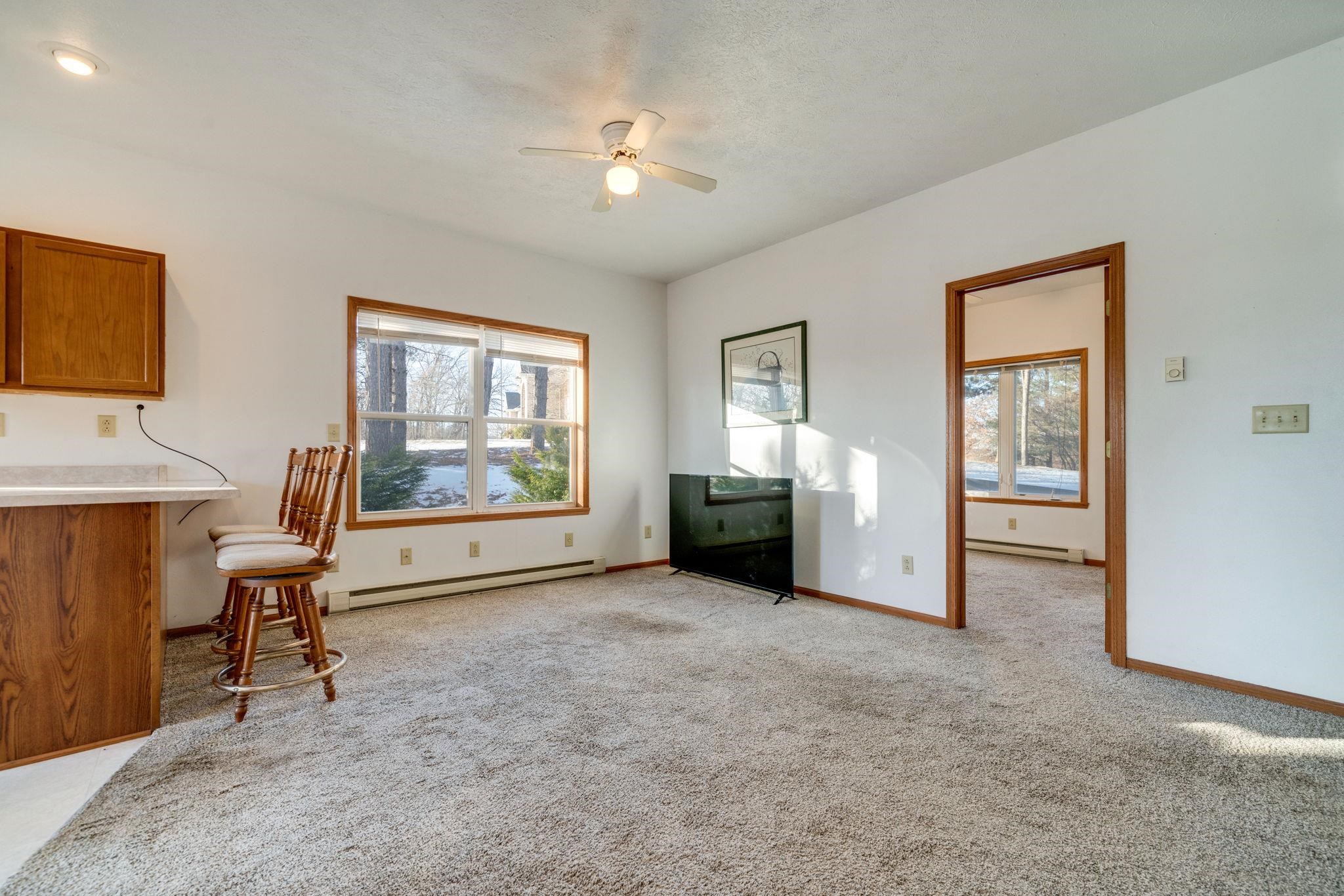 4092 West Pond Road Leaf River, IL 61047 - Photo 35 of 71 a view of a livingroom with furniture and windows