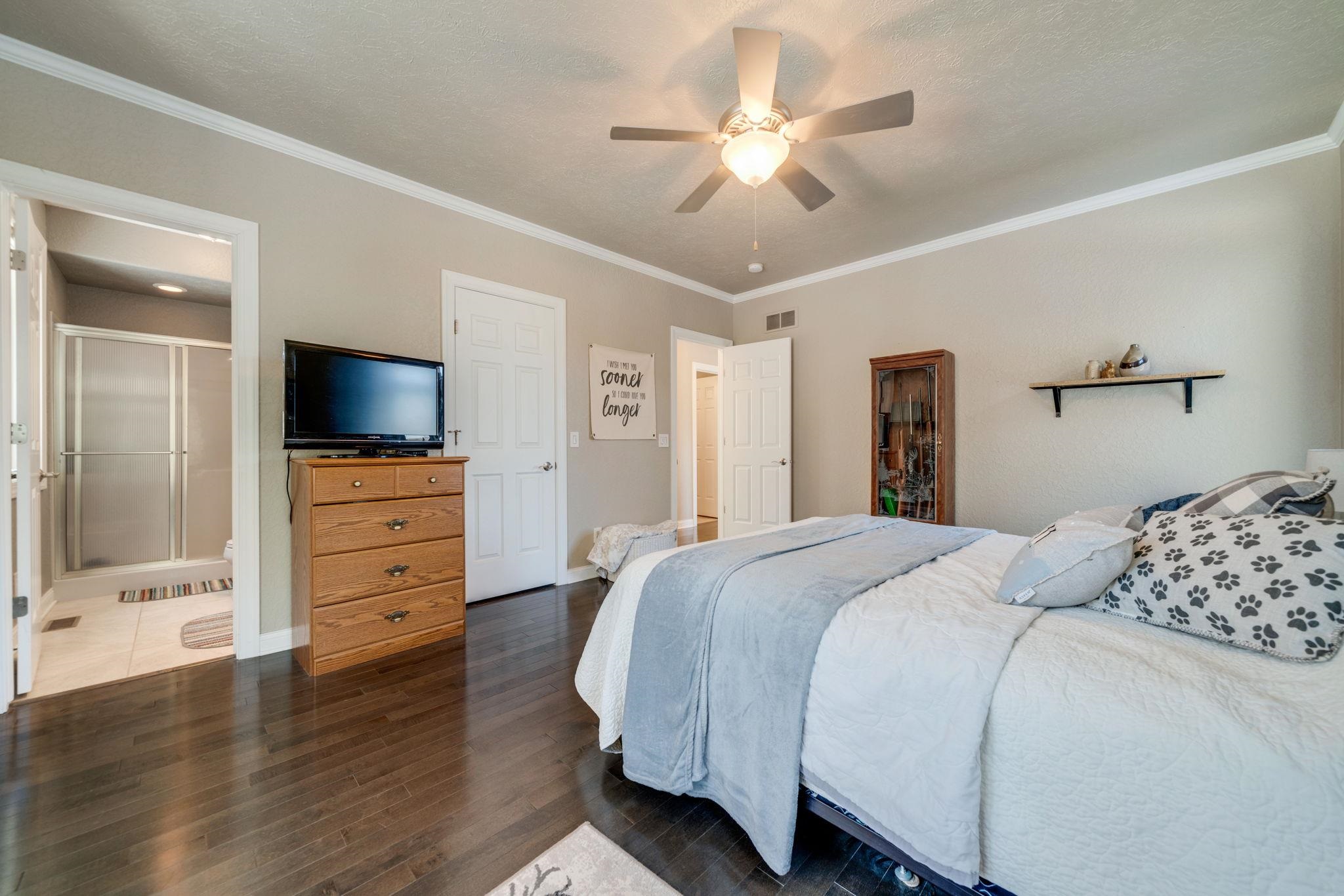 4092 West Pond Road Leaf River, IL 61047 - Photo 43 of 71 a bedroom with a bed and a flat screen tv