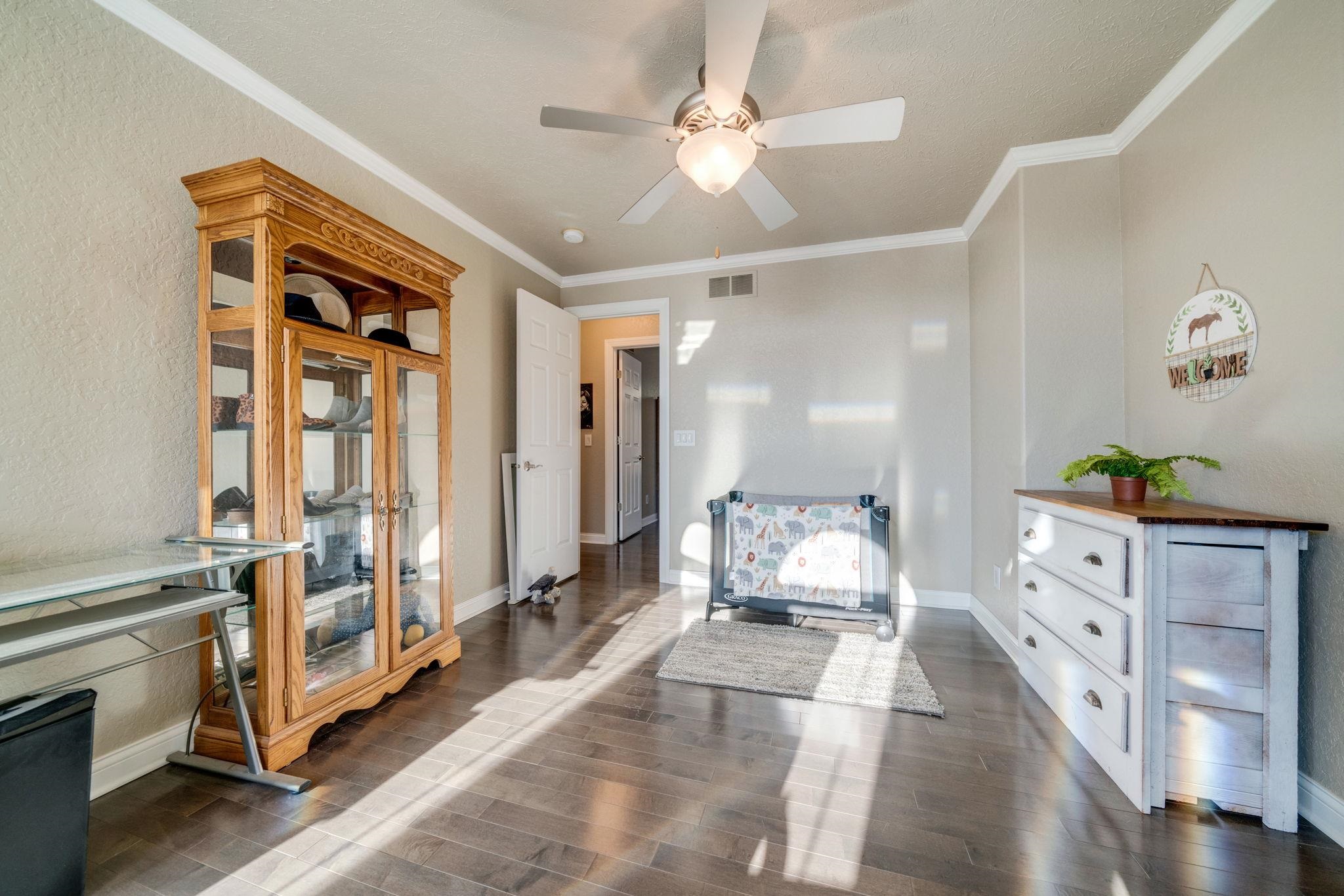 4092 West Pond Road Leaf River, IL 61047 - Photo 46 of 71 a bedroom with furniture and wooden floor