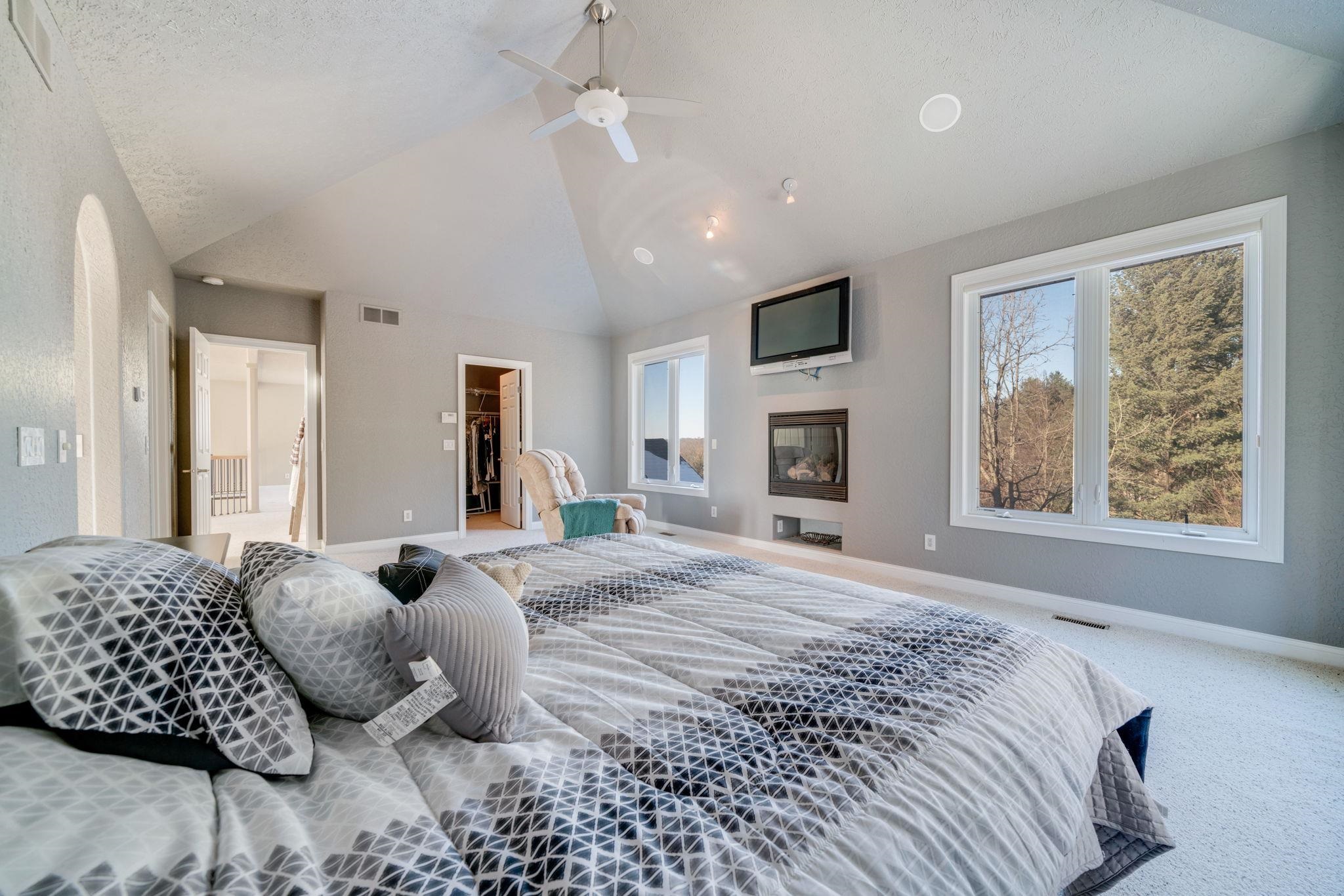 4092 West Pond Road Leaf River, IL 61047 - Photo 53 of 71 a spacious bedroom with a large bed and a window