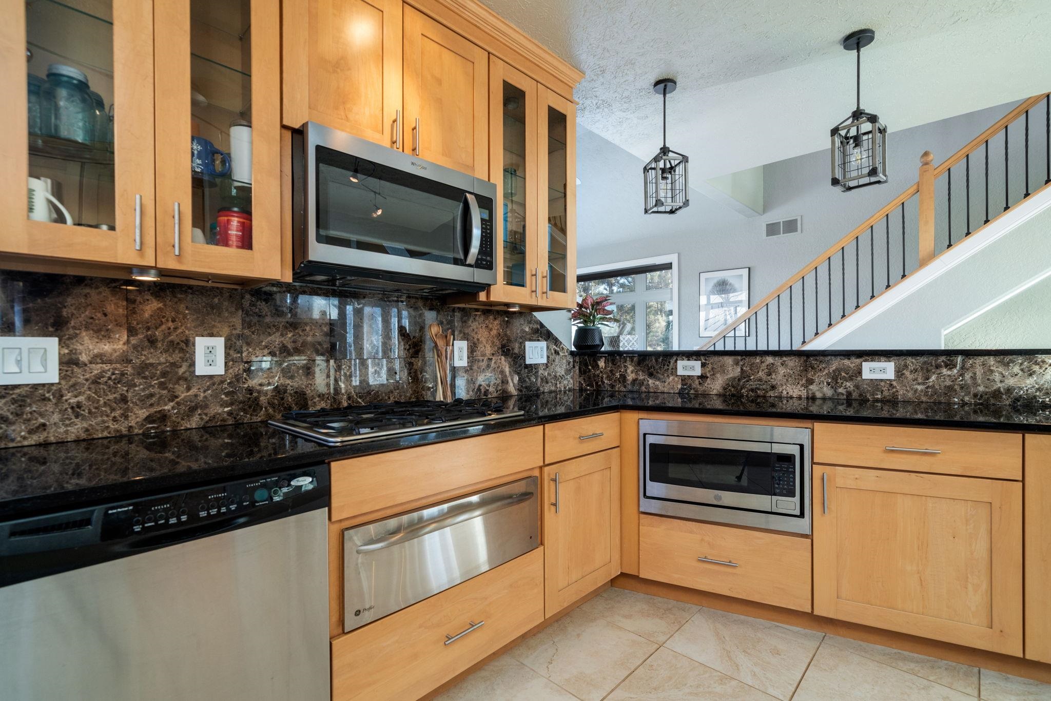 4092 West Pond Road Leaf River, IL 61047 - Photo 6 of 71 a kitchen with stainless steel appliances granite countertop a stove and a microwave