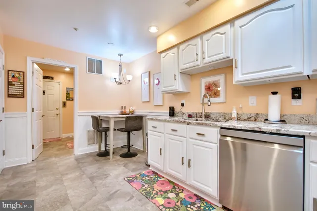 a living room with furniture a flat screen tv and a window