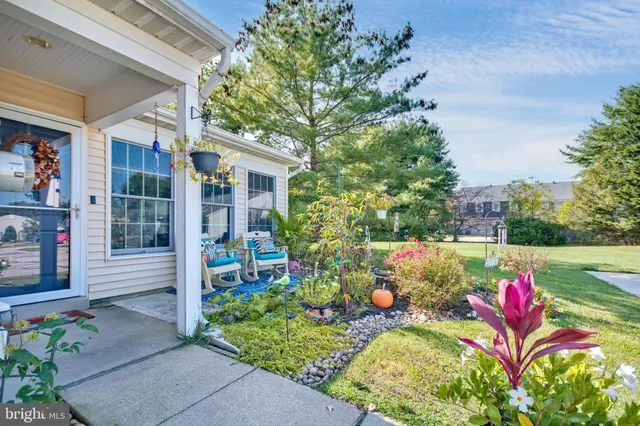 a view of a house with a flower garden