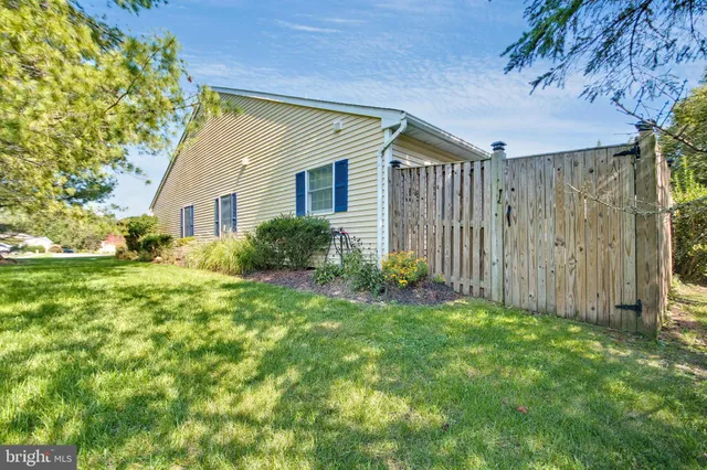 a living room with furniture and flowers