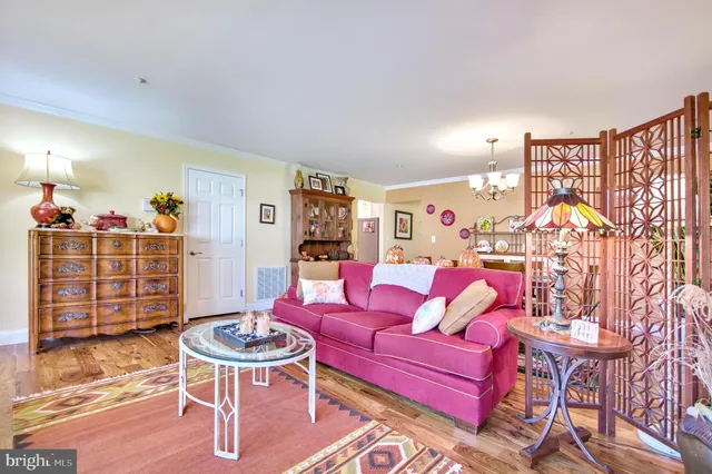 a living room with furniture and a table